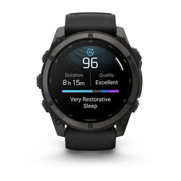 A black Garmin smartwatch with a round display showing sleep and activity metrics, photographed on a clean white background.