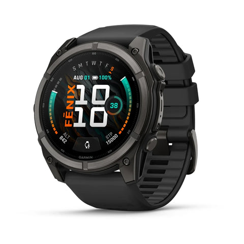 A black Garmin Fenix smartwatch with a round analog-digital display and a textured black strap, shown at a three-quarter angle on a white background.