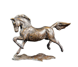Bronze sculpture of a horse in mid-gallop on a white background