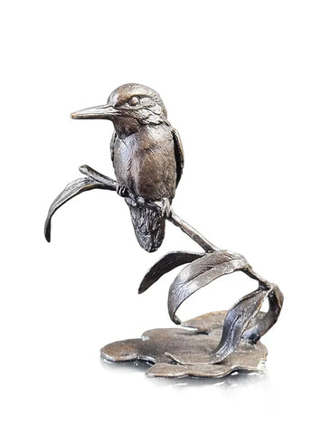 Silver bird sculpture on a white background