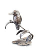 Silver bird sculpture on a white background