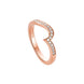 A rose gold ring with a curved, openwork design set with small clear pavé diamonds, shown on a plain white background.