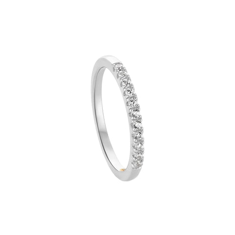 A slim silver band ring featuring a row of small clear gemstones along the front, photographed on a clean white background with a soft shadow.