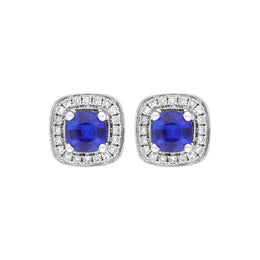 18ct white gold earrings featuring cushion-cut sapphires weighing 0.95 carats, complemented by diamonds totaling 0.19 carats in a claw and pave setting. The earrings exhibit a refined design that highlights the vibrant sapphires and sparkling diamonds.