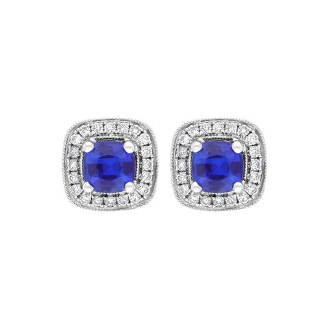 18ct white gold earrings featuring cushion-cut sapphires weighing 0.95 carats, complemented by diamonds totaling 0.19 carats in a claw and pave setting. The earrings exhibit a refined design that highlights the vibrant sapphires and sparkling diamonds.