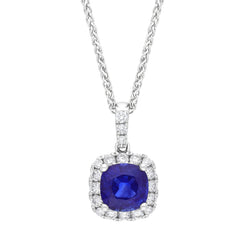 18ct white gold cushion cluster pendant featuring a 1.13-carat sapphire surrounded by diamonds totaling 0.24 carats, designed with a loop for hanging. The pendant is presented on a matching chain, showcasing a stunning and elegant design that highlights t