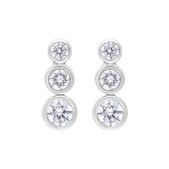 18ct white gold trilogy earrings featuring three diamonds, with the center diamond weighing 0.42 carats. The earrings showcase a classic design, highlighting the brilliance of the diamonds set in a polished white gold setting.