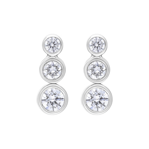 18ct white gold trilogy earrings featuring three diamonds, with the center diamond weighing 0.42 carats. The earrings showcase a classic design, highlighting the brilliance of the diamonds set in a polished white gold setting.