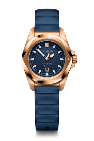 Victorinox watch with blue strap and rose gold casing on a white background