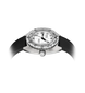 A wristwatch with a silver-toned metal case, white dial, black tachymeter bezel, and black textured strap, shown on a plain white background with a soft glow around the lower edges.