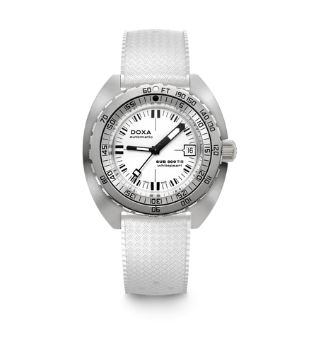 A silver-tone Doxa Sub 300 Titan wristwatch with a textured white strap, featuring a white dial with black markings and a black bezel.