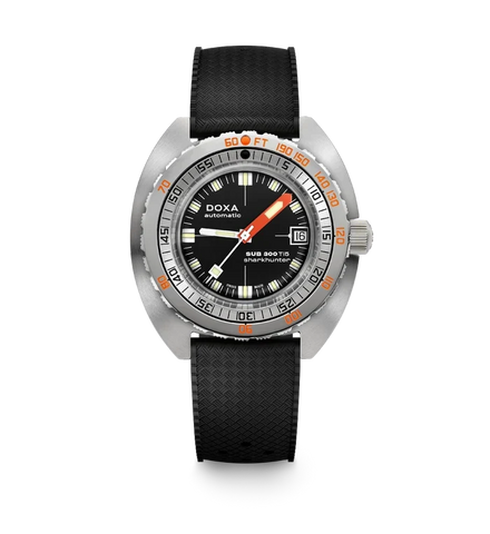 A DOXA Sub Diver 700 wristwatch with a black textured strap, a silver stainless steel case, and a black dial featuring orange and white markings.