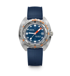 A DOXA Sub Diver 700 wristwatch with a blue textured strap, a silver stainless steel case, a blue dial with white and orange details, and a rotating bezel, shown against a plain white background.