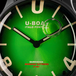 Close-up of a U-Boat watch face with green dial and black bezel.