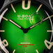Close-up of a U-Boat watch face with green dial and black bezel.