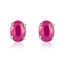 9ct White Gold Ruby 7x5mm Oval Claw Set Stud Earrings. 33-23-058.