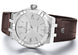 Maurice Lacroix watch with brown leather strap on a white background