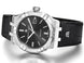 Luxury watch with black dial and leather strap on a white background