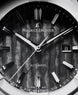 Maurice Lacroix watch face with dark textured dial and brand name.