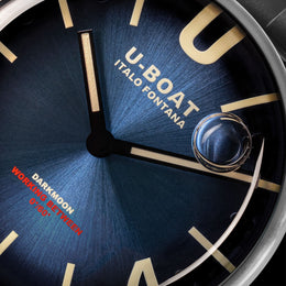 Close-up of a U-Boat watch face with blue background and gold accents