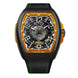 Franck Muller Vanguard Racing skeleton watch with a titanium case, black leather strap with green stitching, and a bold orange and black dial.