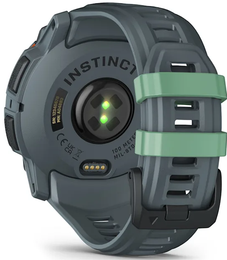 Gray and green smartwatch with 'Instinct' branding on a white background