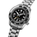 Seiko watch with black dial and silver metal bracelet on a white background