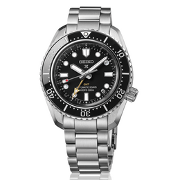 Seiko watch with black dial and silver metal strap on a white background