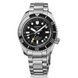 Seiko watch with black dial and silver metal strap on a white background