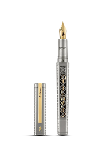 A silver and gold fountain pen with an intricate cutout pattern on the barrel, shown with its cap removed and standing beside it on a plain white background.