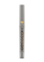 A luxury fountain pen with a silver-gray body, featuring intricate gold-toned filigree detailing on the barrel and a small gold-toned emblem near the top, set against a solid white background.