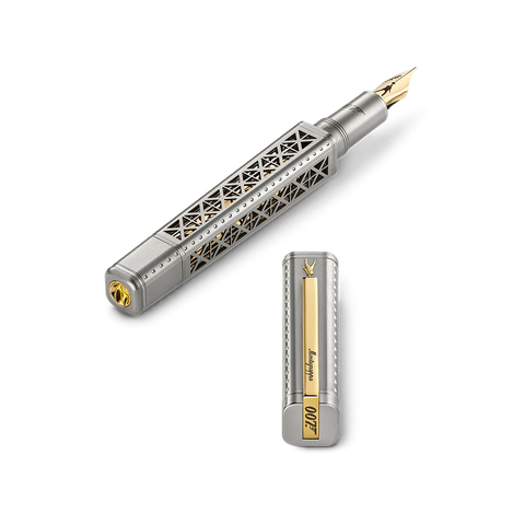 A silver-toned fountain pen with an Eiffel Tower-inspired geometric cutout design on the barrel, shown alongside its cap. The pen features a gold nib and gold accents, including a gold-plate clip on the cap.