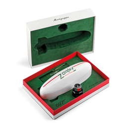 A Montgolfi 007 Zorin personal air rifle presented in an open red and white gift box with a green interior, alongside its open presentation box showing the molded compartment.