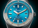 Squale watch with blue dial and silver case on a dark background