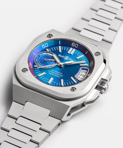 Silver watch with a blue face on a white background