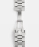 Close-up of a silver watch strap with a brand logo on a white background