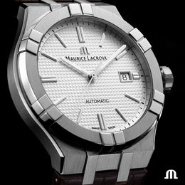 Silver Maurice Lacroix watch with a white face on a black background