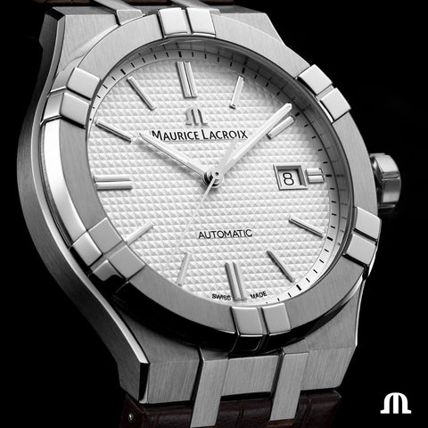 Silver Maurice Lacroix watch with a white face on a black background