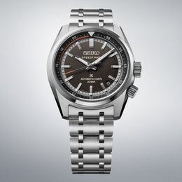 Seiko watch with silver bracelet on a gray background