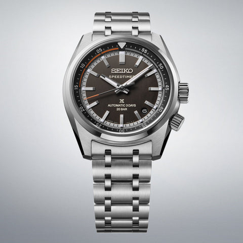 Seiko watch with silver bracelet on a gray background