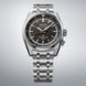 Seiko watch with silver bracelet on a gray background