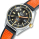 Watch with black face, orange accents, and orange leather strap on a white background