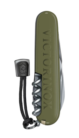 Green Victorinox pocket knife with keychain on a white background