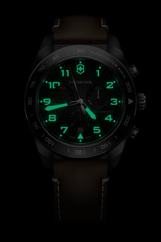 Black watch with green digital display on a black background