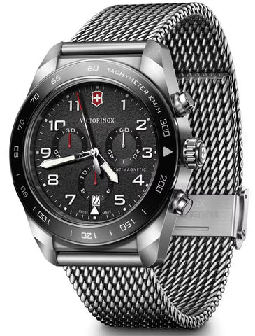Victorinox watch with black dial and silver mesh band on a white background