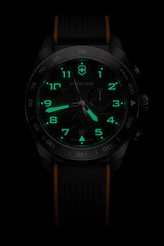 Watch with green digital display on a black background