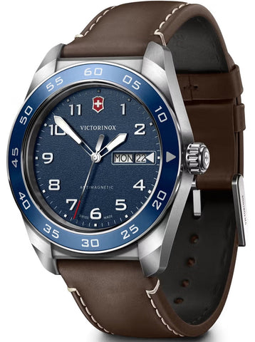 Victorinox watch with brown leather strap and blue dial on a white background
