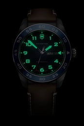Black wristwatch with green digital display on a black background