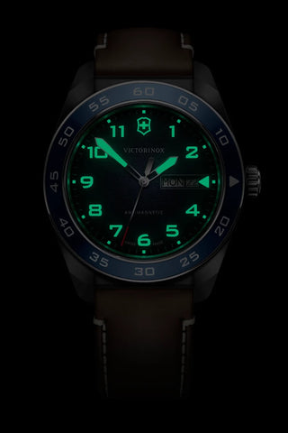 Black wristwatch with green digital display on a black background