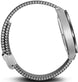 Silver watch with a braided metal band on a white background